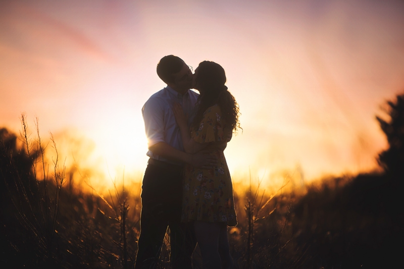 Couples Photographer, couple kissing at sunset