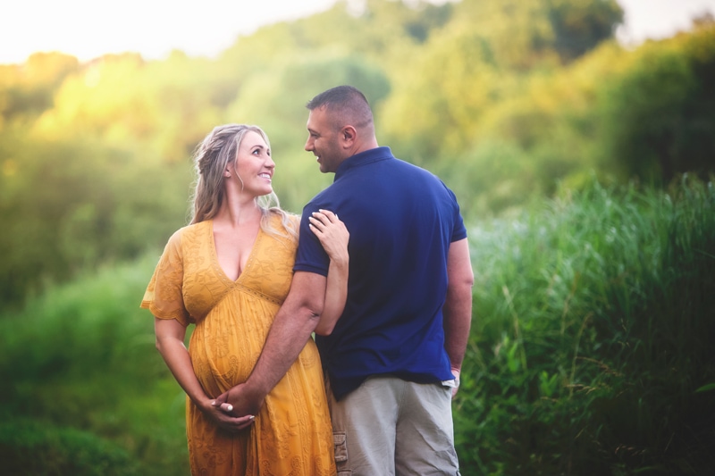 Maternity Photographer, man holding pregnant woman's belly