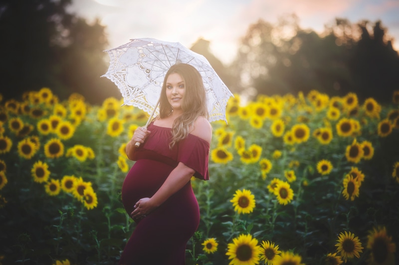 Maternity Photographer, woman in red dress holding umbrella