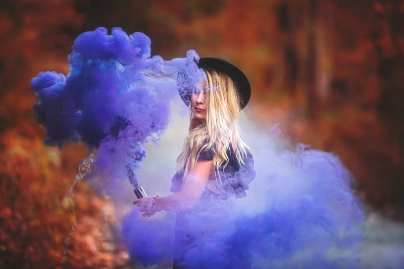 Portrait Photographer, woman with a purple smoke canister