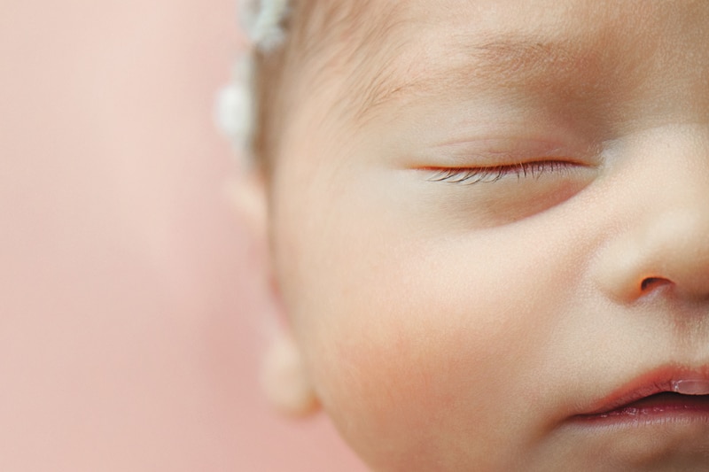 Newborn Photography, close up shot of half of baby's face